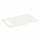White plastic cutting board with a handle on one side, placed on a plain background.