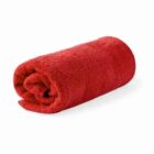 A rolled-up red towel on a white background.