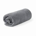 A rolled-up gray towel on a white background.