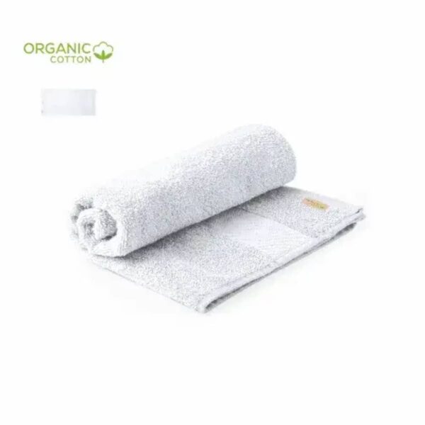 A rolled white organic cotton towel on a matching flat towel, with Organic Cotton text.