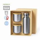 Three stainless steel containers with wooden lids and a bottle in a cardboard gift box.