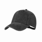 Black denim baseball cap with curved brim and adjustable strap, isolated on a white background.