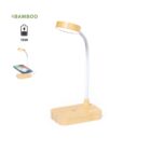 Bamboo desk lamp with wireless phone charger on wooden base, 15W power.