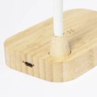 Wooden base with a white pole, USB port, and a small cross mark on the surface.