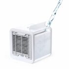A small white portable air cooler with water being poured into its top compartment.