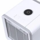 Close-up of a white portable air cooler with a power button on top.