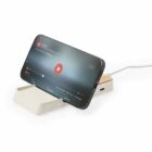 Smartphone on a charging stand displaying a video playback screen.