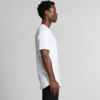 Man in a white t-shirt and black pants standing in profile against a plain background.