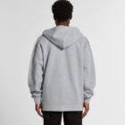 Person wearing a gray hoodie facing away from the camera against a plain background.