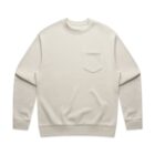 Cream-colored long sleeve sweatshirt with a chest pocket, laid flat on a white background.