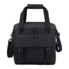 Black tote bag with front pocket, shoulder strap, and top handles against a white background.