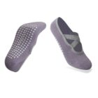 Pair of purple ballet-style socks with light gray trim. One sock is shown upright with crisscross straps, and the other is flipped to display the non-slip white dot pattern on the sole.