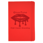 Red notebook with an elastic band. The cover features an illustration of lips with dripping gloss and text that reads GlossTone and High-Impact Branding.