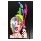 A black notebook with an elastic band, featuring a colorful design of a woman with multicolored hair and vibrant paint splashes on the cover. Text reads ColourSplash High-Impact Branding.