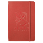 Red notebook with an embossed image of an airplane and the text CIRRUS AIRCRAFT on the cover. The notebook has a matching red elastic band.