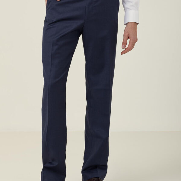 A person wearing a white dress shirt and dark blue formal trousers, standing with one hand in a pocket. The outfit is completed with dark brown dress shoes. The background is plain and neutral.