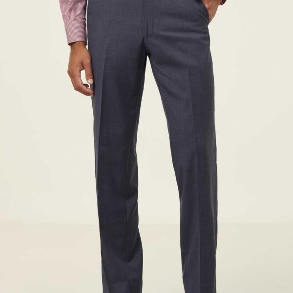 A person wearing a pink dress shirt and gray dress pants is standing against a neutral background. The shirt is long-sleeved, and the pants are straight-cut. Only the upper legs and torso are visible. The person is also wearing black shoes.