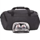 Black duffel bag with a separate shoe compartment holding a pair of gray sneakers.