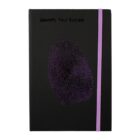 A black notebook with a purple fingerprint design and the words Identify Your Success on the cover. It has a purple elastic band for closure.