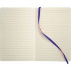 An open lined notebook with cream-colored pages and a purple ribbon bookmark. The notebook is lying flat, showing two pages with horizontal lines for writing.