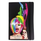 A notebook cover featuring a woman with rainbow-colored hair and vibrant paint splashes. She holds a paintbrush and has her mouth open in excitement. The text ColourSplash High-Impact Branding is displayed at the bottom.