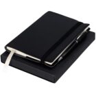 Black notebook with a pen and ribbon bookmark, placed on top of a closed black box.