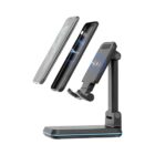 Adjustable wireless charging stand charging a smartphone, with phone floating above the stand.