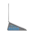 A slim laptop on a gray stand labeled MOUNTAIN NATURAL SPRINGWATER in blue text.