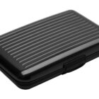 A closed black, ridged hard-shell card holder case.