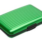 Green metallic wallet case with ridged surface and a black clasp, closed.