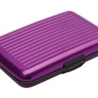 A purple, ridged, hard-shell wallet case with a black clasp.