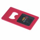 Red card-shaped bottle opener with US Open logo and a black rectangular section in the center.