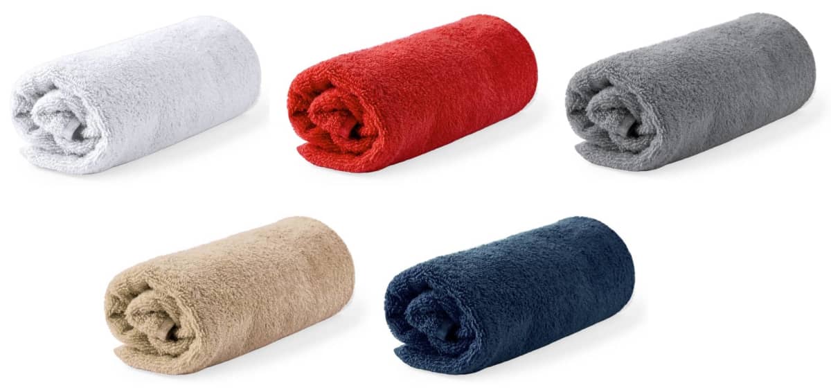 Five rolled-up towels in white, red, gray, beige, and navy blue colors on a white background.