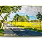 Car sunshade with a house and garden logo, trees, a road, and contact details.