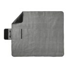 A gray rectangular picnic blanket with black trim, partially folded at one corner.