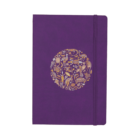 A purple notebook with an elastic band closure. The cover features a circular design in the center, composed of various golden artistic motifs, including leaves, animals, and abstract shapes.