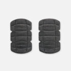 A pair of Explorer Shield knee pads, black with curved edges and grooved lines.