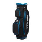Black TaylorMade golf bag with blue accents. It features multiple zippered pockets and compartments, with the TaylorMade logo visible in white. Designed for carrying golf clubs and accessories.