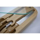 A wooden box with a knife and a glass lid.