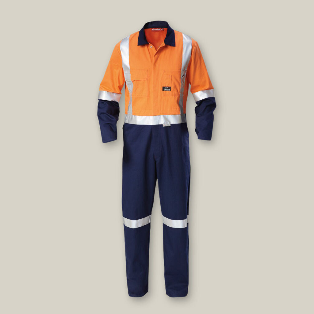 Explorer Shield hi-vis coverall in orange/navy with reflective safety stripes.