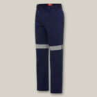 Explorer Shield navy blue work pants with silver reflective bands, shown on beige.