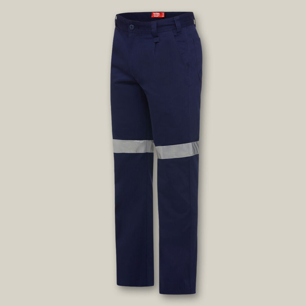 Explorer Shield navy blue work pants with silver reflective bands, shown on beige.