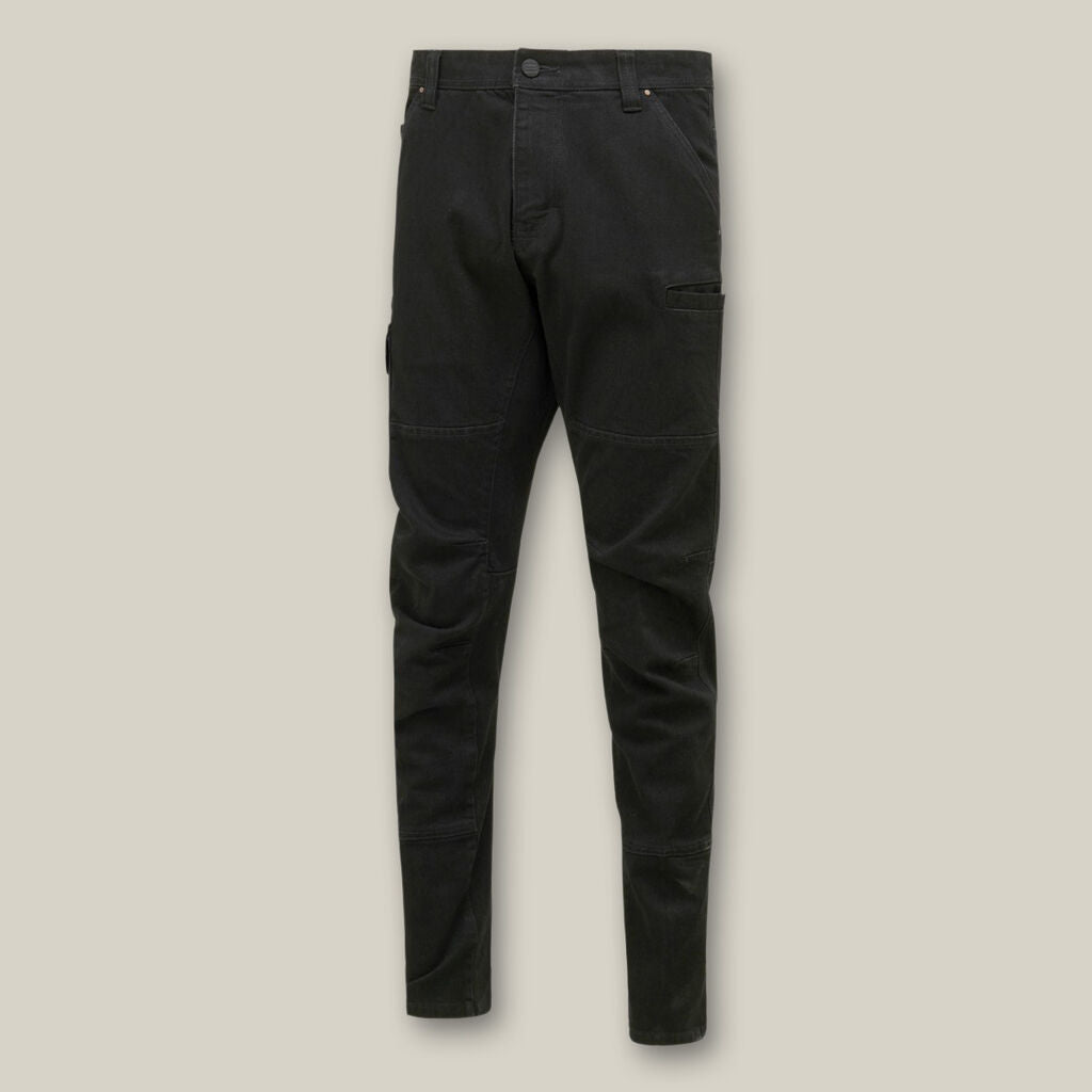 Black slim-fit Explorer Shield cargo pants with multiple pockets on a beige background.