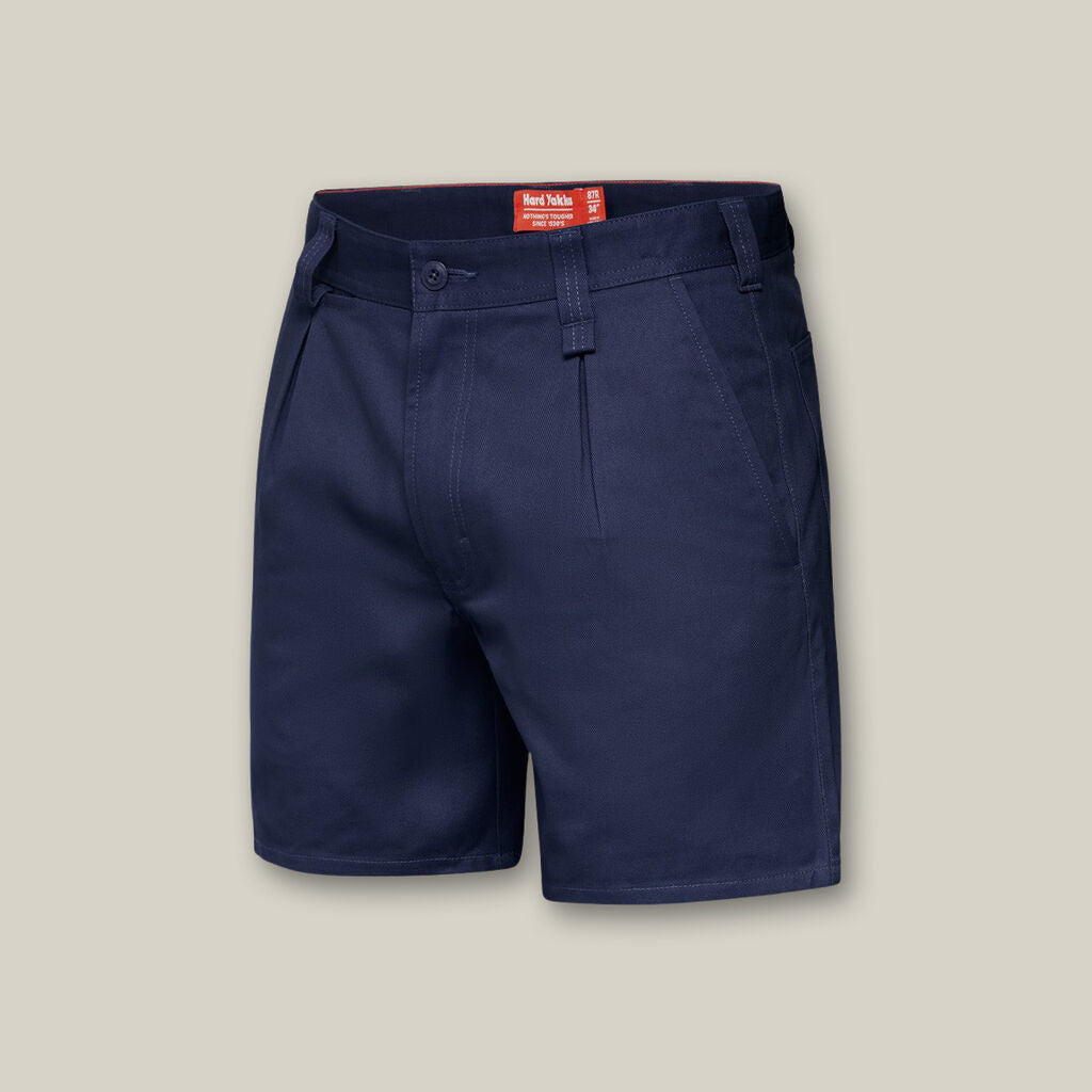 Navy blue shorts, shown against a light gray backdrop similar to an Emz A5 Notebook cover, feature a button and zip closure, belt loops, side pockets, and visible inner waistband tags.