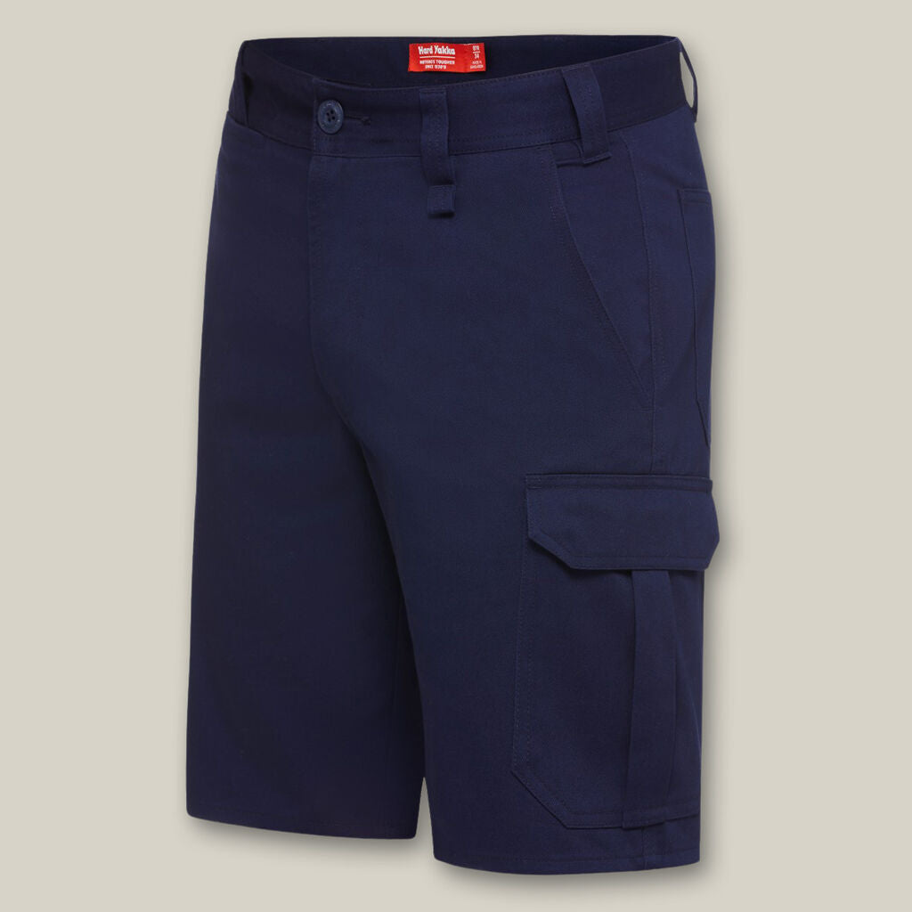 Explorer Shield navy cargo shorts with side pockets shown on a beige background.