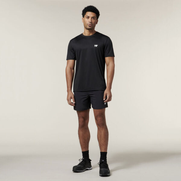 Man in black athletic wear and sneakers stands ready with his Explorer Shield.