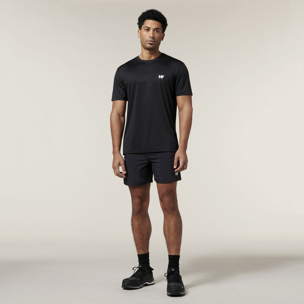 Man in black athletic wear and sneakers stands ready with his Explorer Shield.