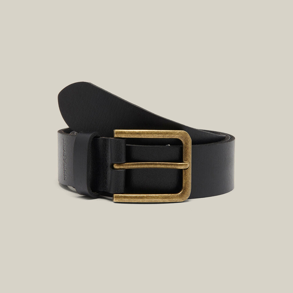 Black leather Explorer Shield belt with brass buckle on a neutral background.