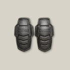 Two black Explorer Shield armor pads on a plain light background.