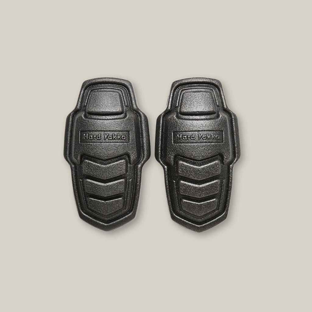 Two black Explorer Shield armor pads on a plain light background.